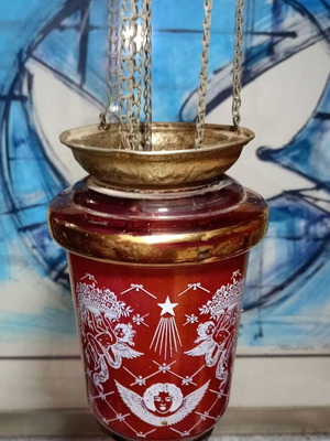 Red hanging glass oil lamp with white cross design