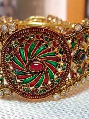 Tsagkarakis women's metal bracelet used with red and green stones