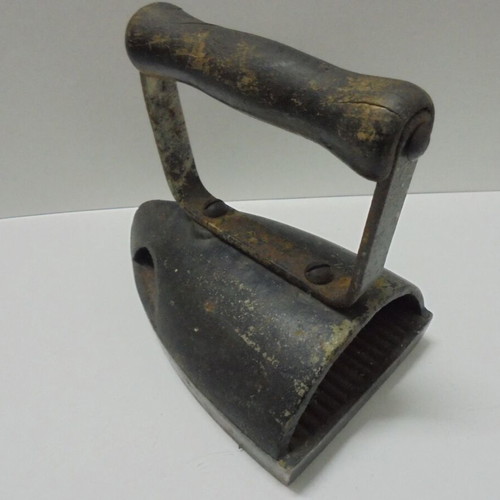 Old cast iron iron with internal heating plate used