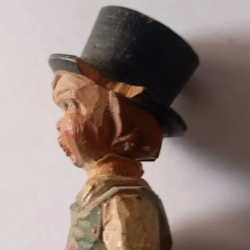 Cork used with carved wooden bottle stopper and boy figure