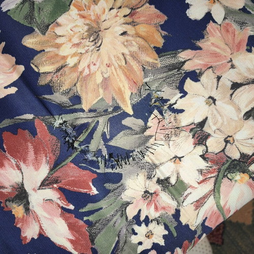 Three-seater sofa with pull-out bed and floral upholstery