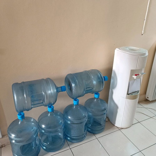 Water cooler used with 6 bottles for cold and hot water