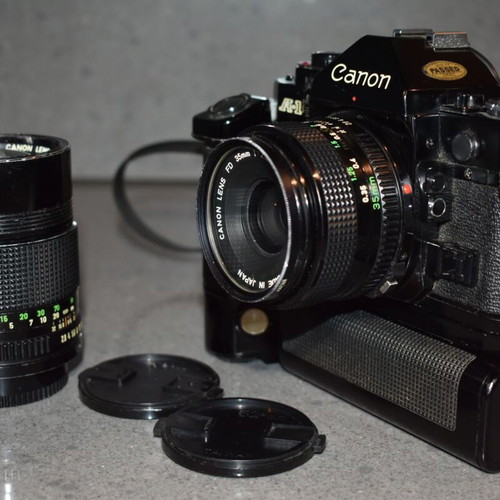Canon A-1 collectible pack like new with Motor Drive, strap and 35mm f/2.8, 135mm lenses