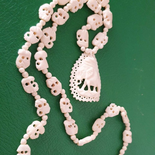 Carved vintage bone necklace with elephant pendant