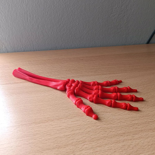 Articulated hand new, 3D printed, red PLA