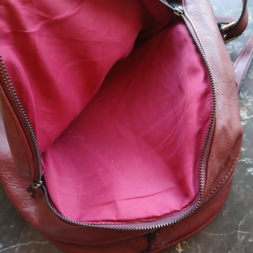 Women's burgundy backpack bag used
