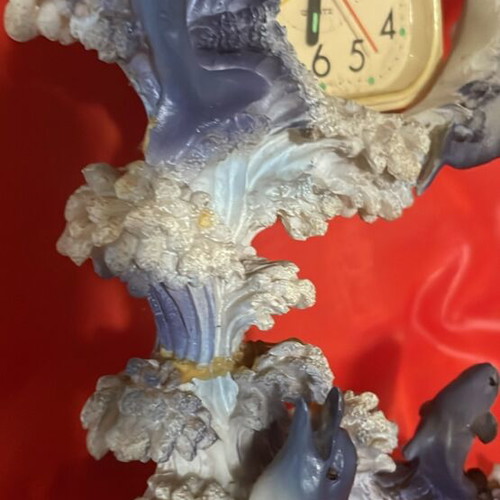 Clock used with dolphins around