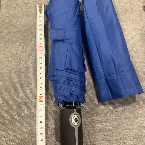 Blue folding umbrella branded with NIKMI AD new