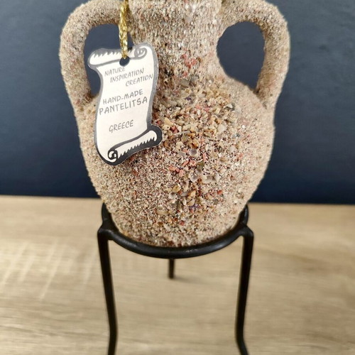 Handmade ceramic amphora decorative vase on metal base used
