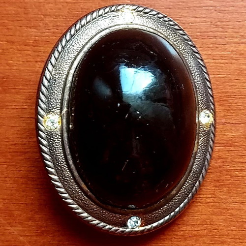 Vintage brooch used with black stone and silver frame