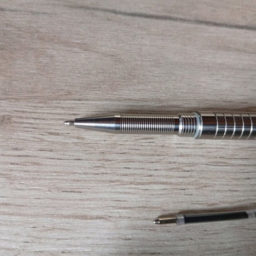 Mini titanium pen like new with Frag Pattern and carbide tip