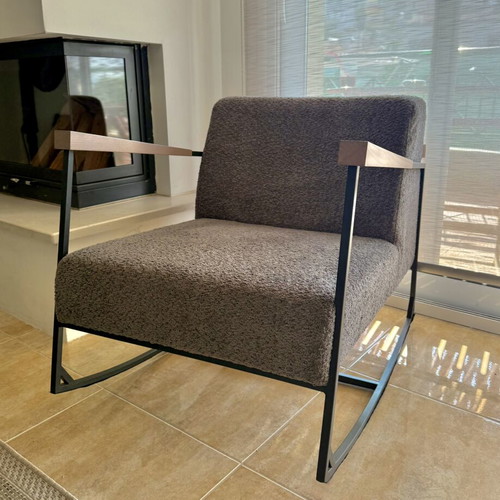 Rocking armchair with grey boucle fabric