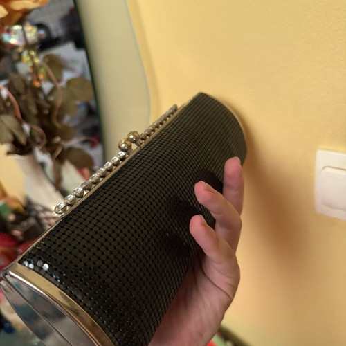 Black evening clutch bag with metallic details