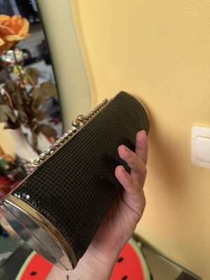 Black evening clutch bag with metallic details