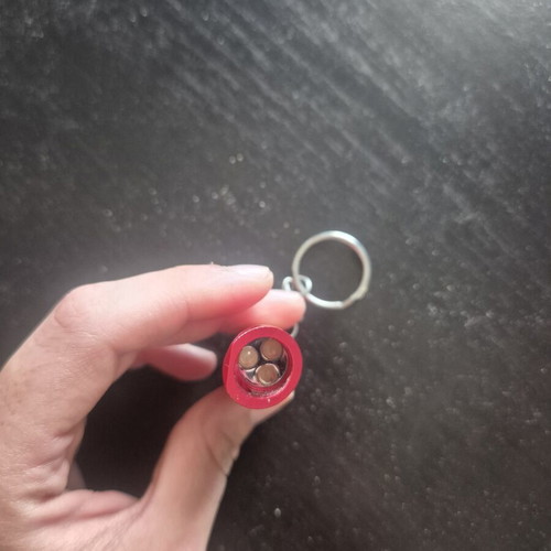 Mini LED flashlight keychain with bottle opener like new, red