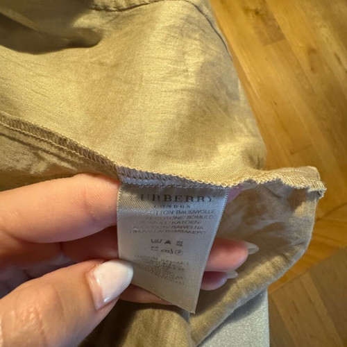 Burberry shirt used in beige satin shade with gold details