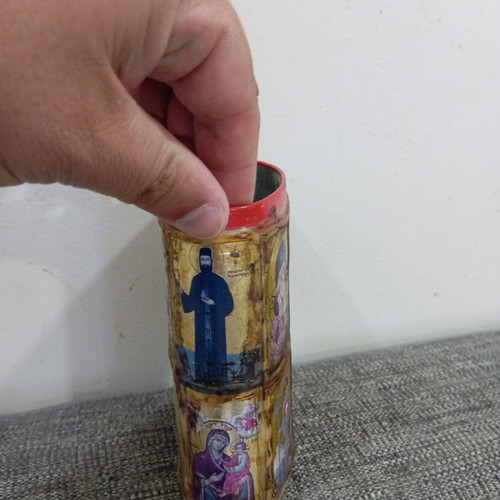 Vintage metal pencil holder decorated with icons used