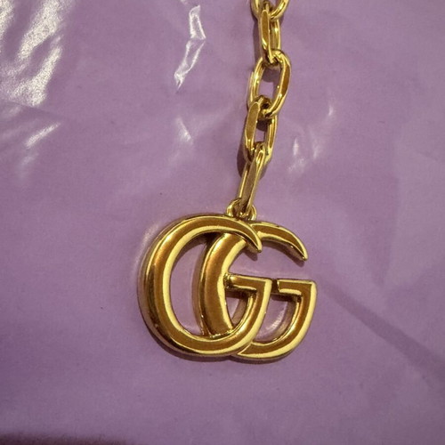 Gucci gold necklace with large GG pendant and chain, new