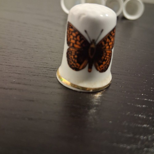 Vintage porcelain thimbles with butterfly, like new
