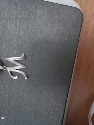 Necklace bracelet used with initial M made of silver steel