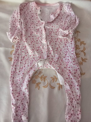 Baby romper with pink floral pattern