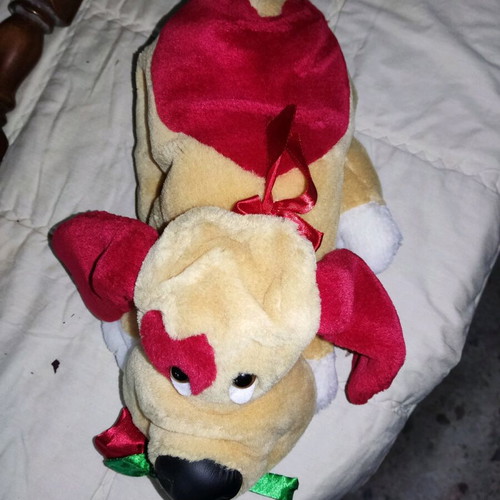 Stuffed dog used with heart and flower