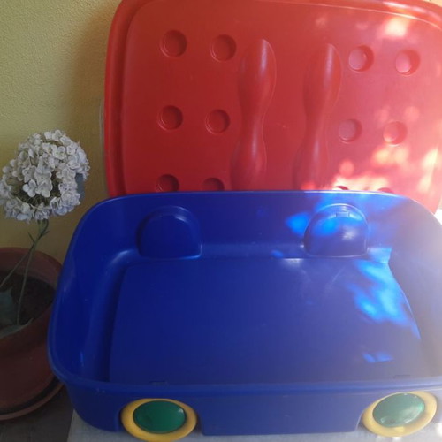 Plastic storage box for toys used with wheels