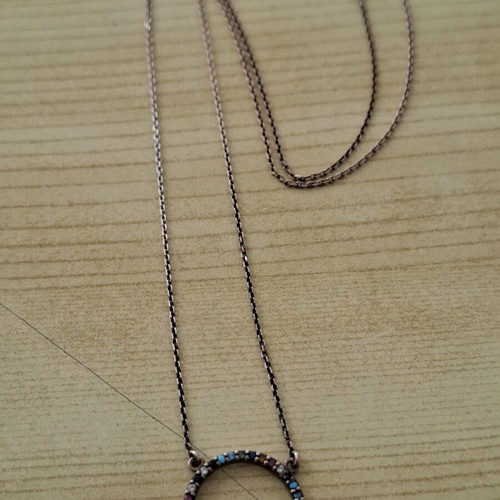 Necklace with circle pendant like new, multicolored stones