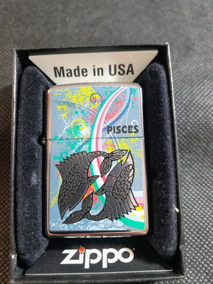 Zippo lighter new with Pisces zodiac made in USA