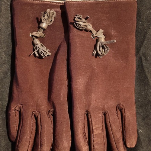 Women's brown gloves used with fleece lining and decorative tassels