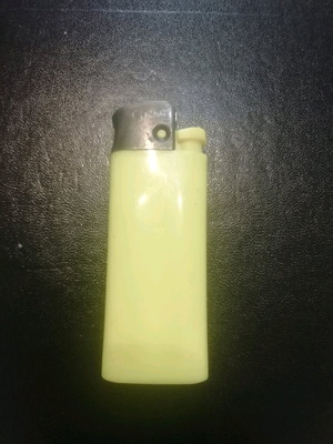 Small lighter like new, yellow filled