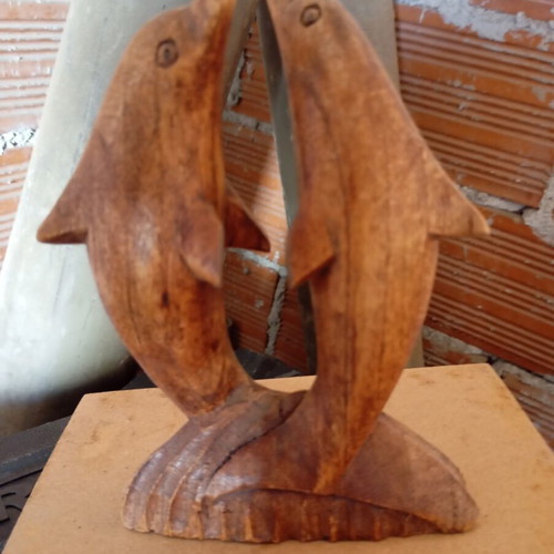 Handcrafted wooden sculpture of two dolphins, unique piece