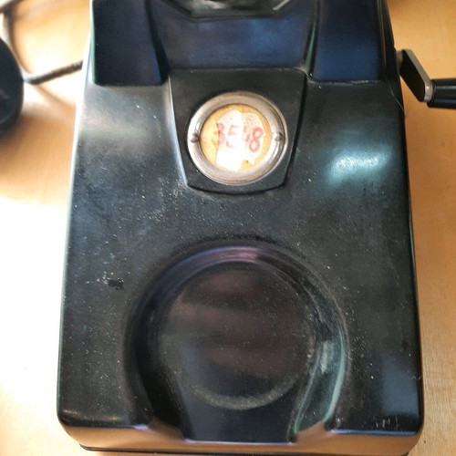 Antique telephone with crank used, 1920-30