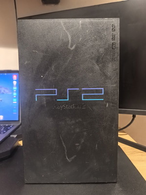 PlayStation 2 fat used console with plastic damage