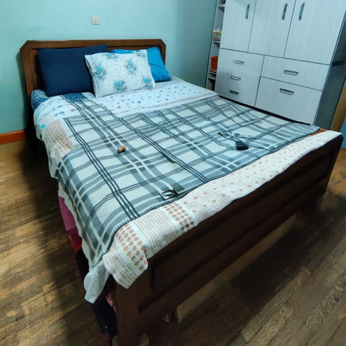 Double wooden bed with mattress