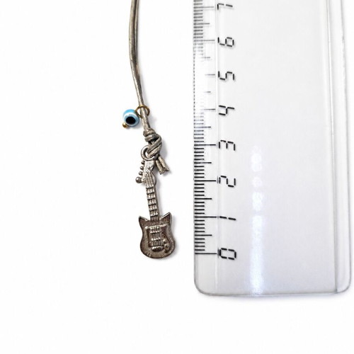 Guitar Keychain like new with metal detail and vintage blue eye