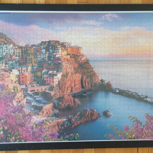 Framed puzzle like new, dimensions 0.65x0.95 m