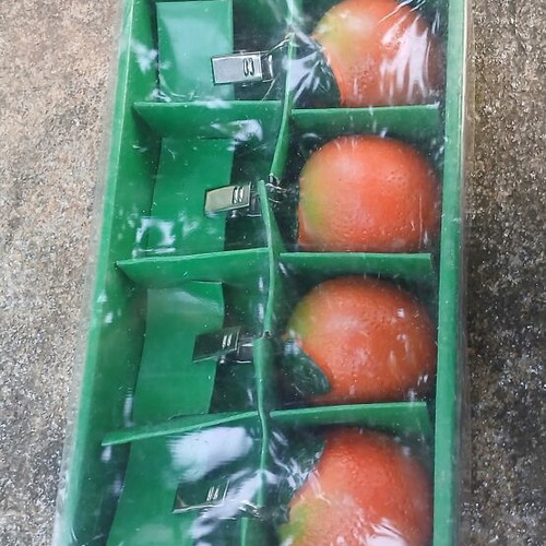 Tablecloth weights with orange design