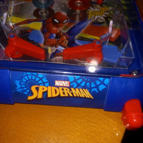 Electronic tabletop pinball used with digital scoring and sound effects