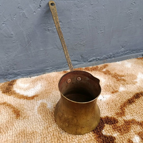 Old cezve handmade with engraved handle, used