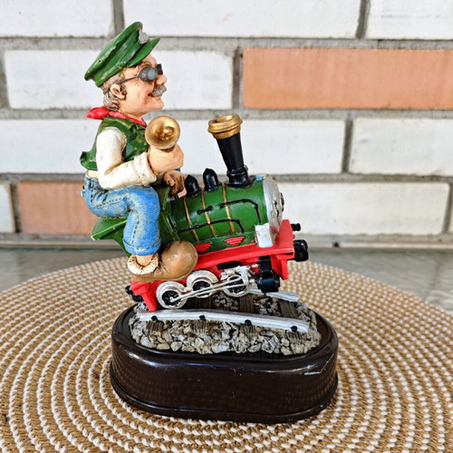 Decorative figure with motion sensor used, train engineer on locomotive