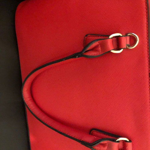 Red handbag used with wear marks