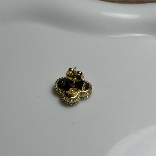 Steel earring black and gold, like new, single piece