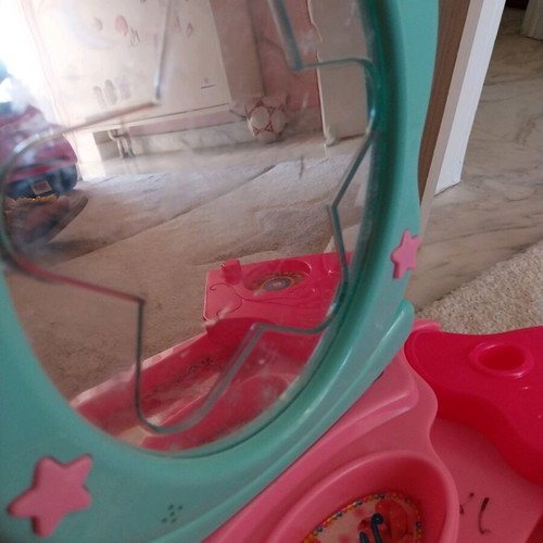 Children's beauty vanity used with cosmetics and light-up mirror
