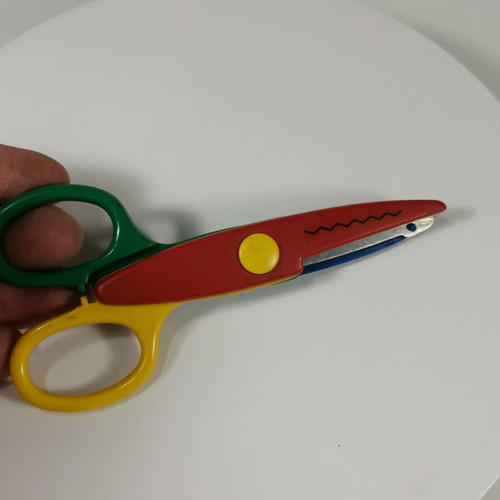 Craft scissors used with colorful zig-zag cuts for kids
