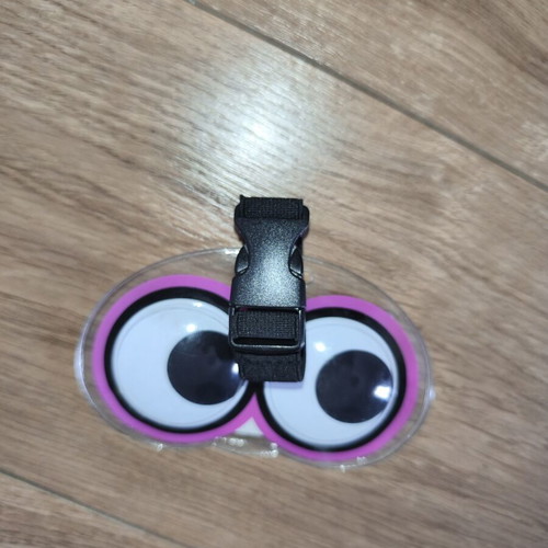 Luggage tag with moving eyes, new