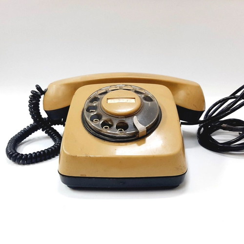 Vintage rotary phone used, beige, 1970s