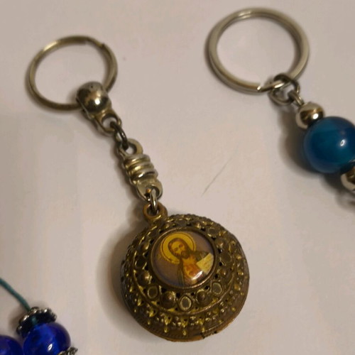 Set of 3 keychains like new with Meteora, evil eye and religious images