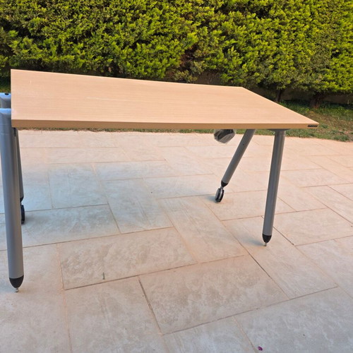 Dromeas desk with wheels used, light wood surface and metal frame