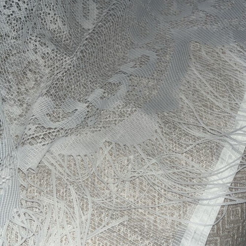 White vintage lace curtain with fringes